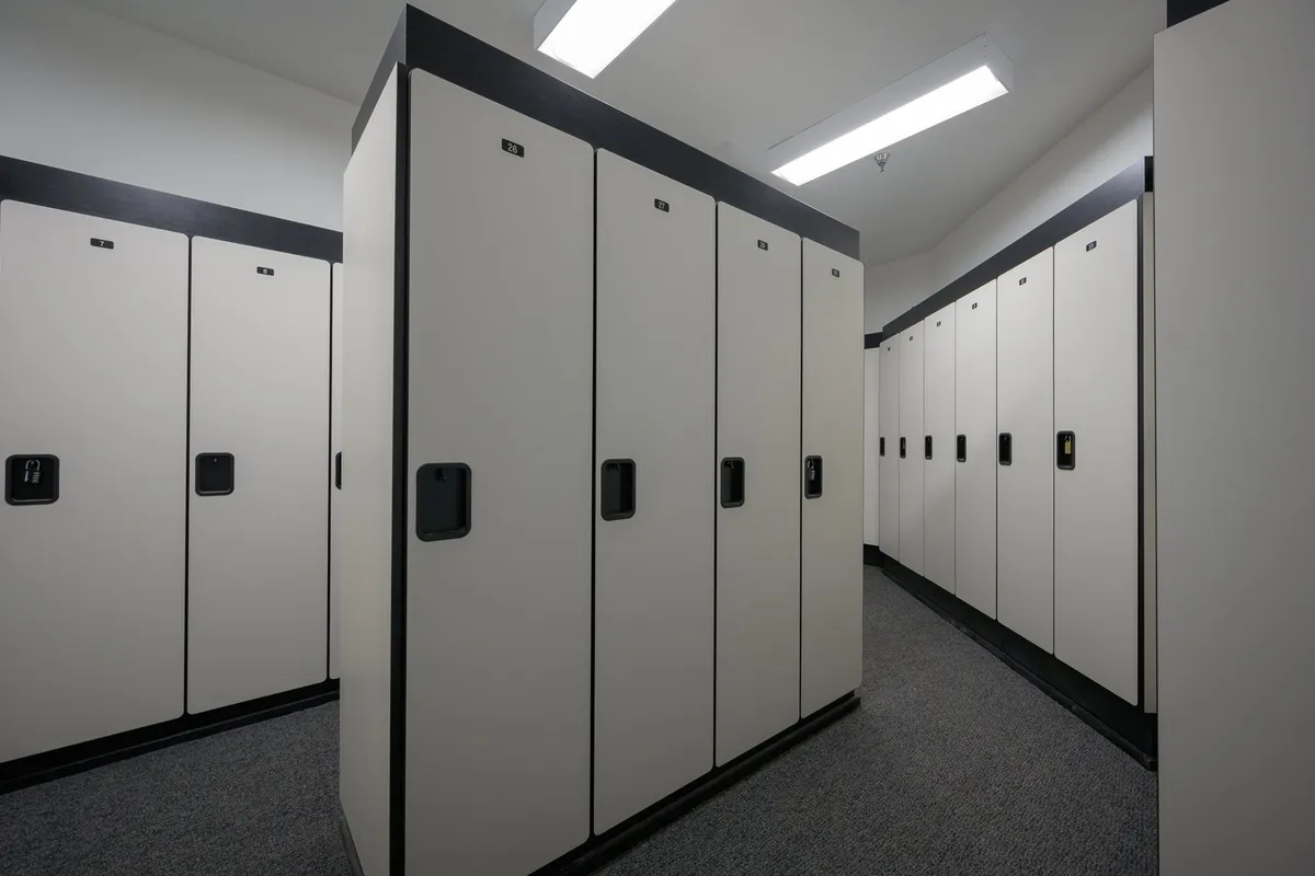This image shows a clean, well-lit storage area with multiple lockers, ideal for storing personal gear such as skis and bikes. The setting is practical and secure, emphasizing the convenience available to residents for keeping their equipment safe and organized.